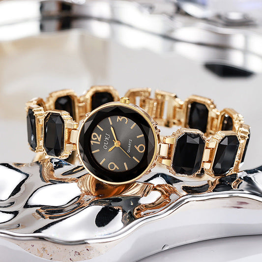 Women’s Gold Bracelet Quartz Watch with Black Crystal Dial